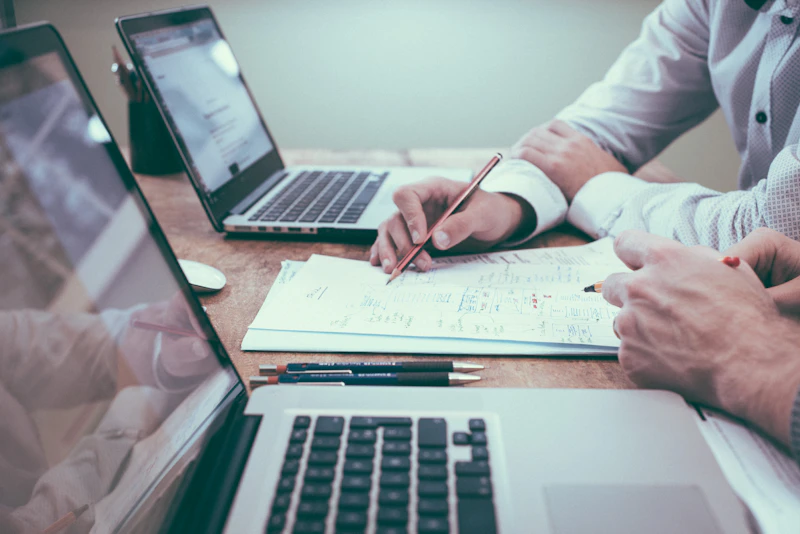 Professional team reviewing regulatory compliance documents